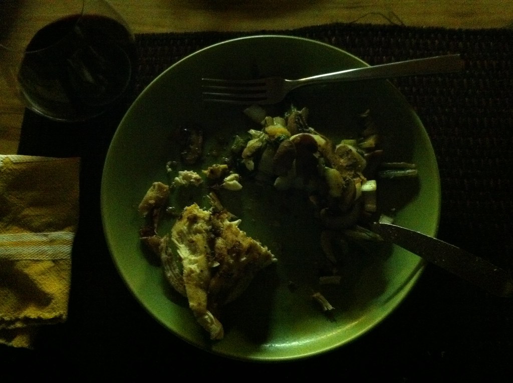 A quiet kitchen table prepared for an evening meal